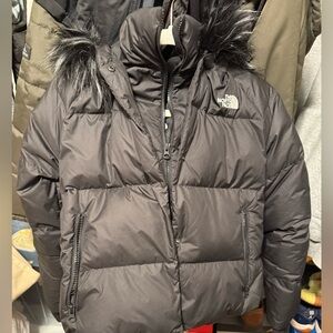 Women’s black north face jacket.